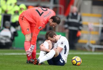 BOURNEMOUTH, ENGLAND - MARCH 11: Asmir Begovic of AFC Bournemouth speaks to Harry Kane of Tottenham Hotspur as he goes down injured during the Premier League match between AFC Bournemouth and Tottenham Hotspur at Vitality Stadium on March 11, 2018 in Bournemouth, England. (Photo by Catherine Ivill/Getty Images)